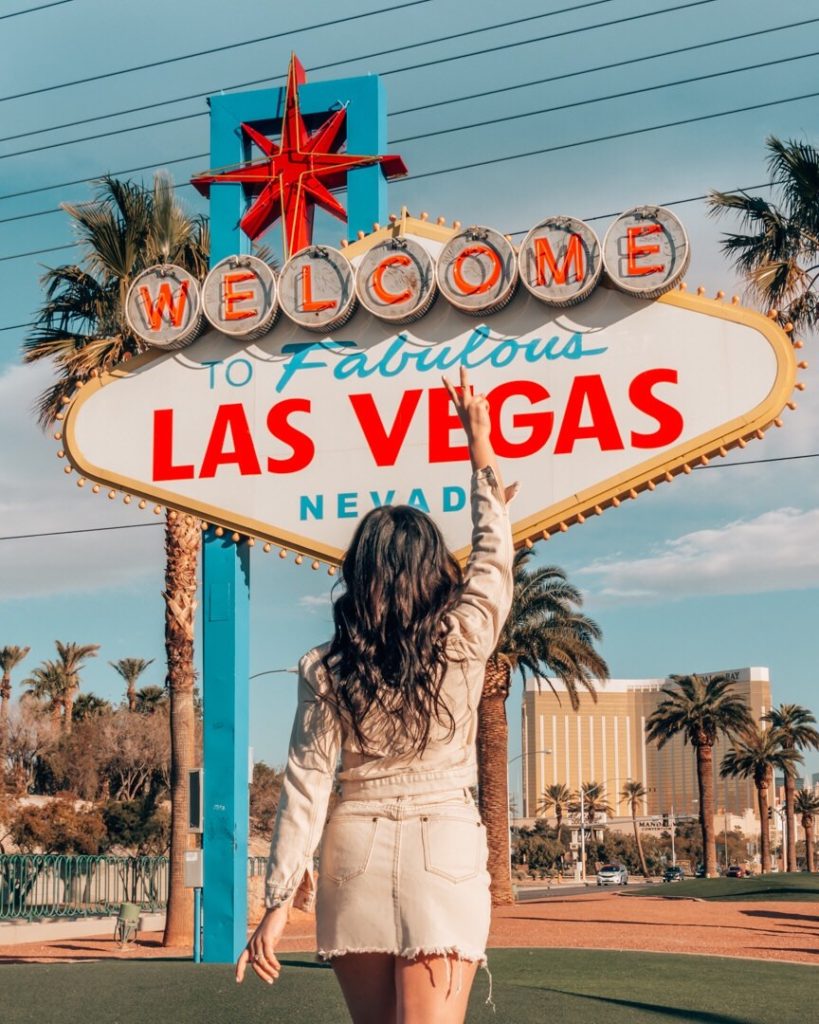 Woman standing in front of Las Vegas sign