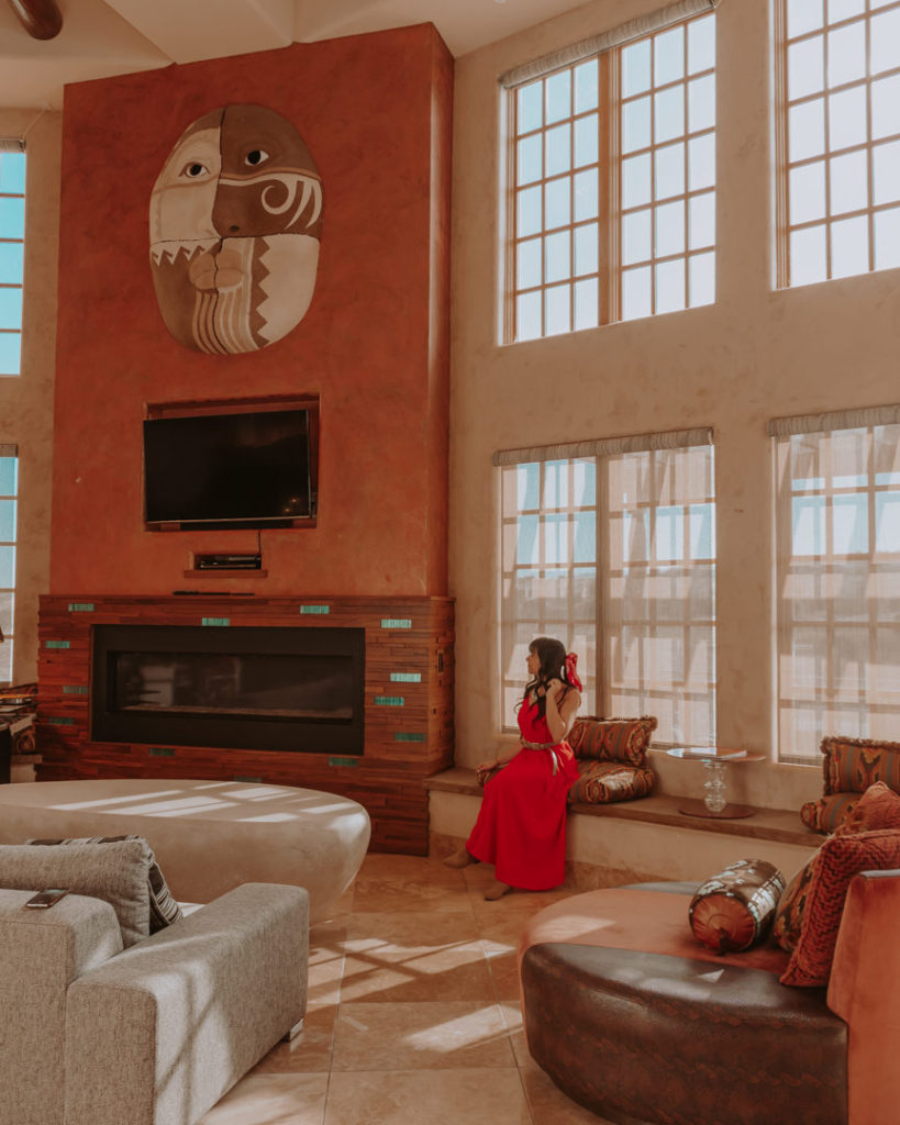 Woman in red dress in southwest themed room