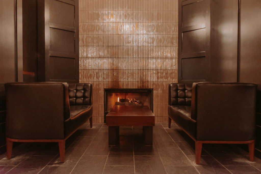 Brown leather couches and fireplace at Park Central San Francisco