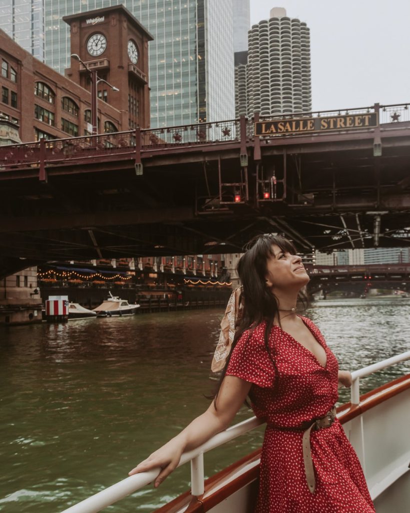 Woman in red dress on boat