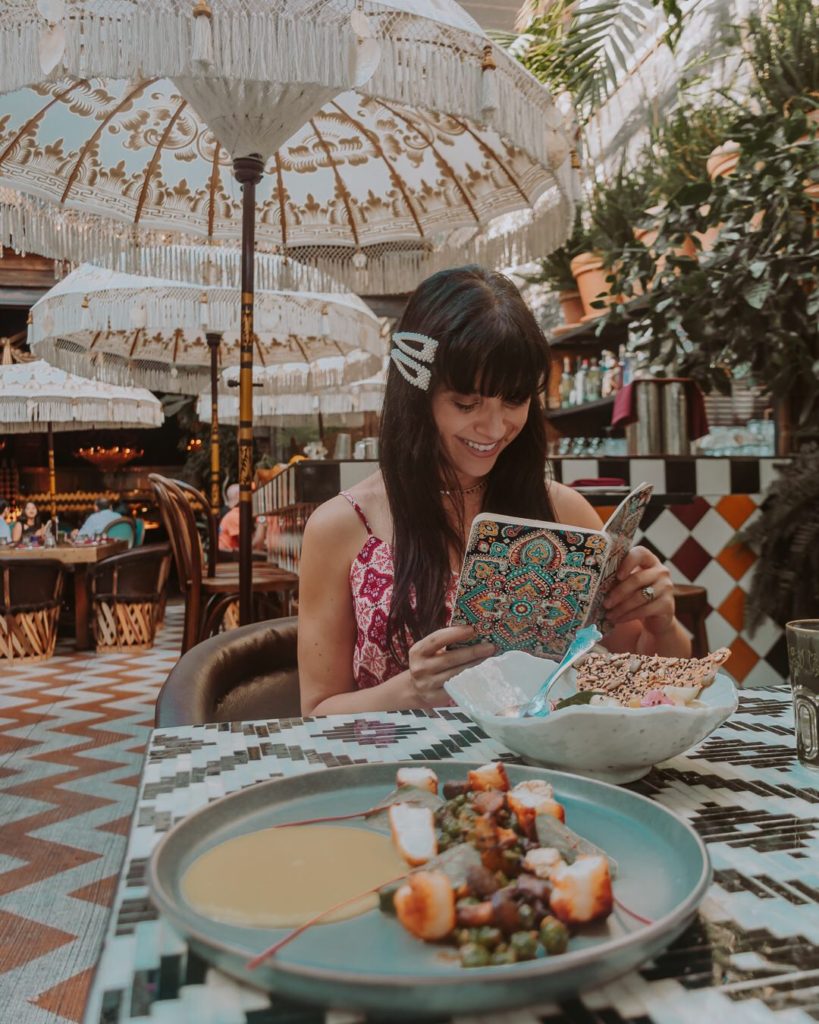 Woman reading menu at restaurant