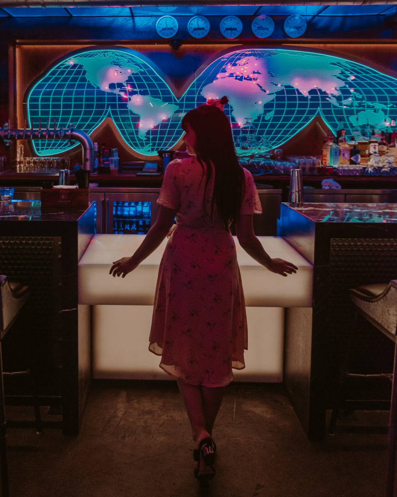 Woman standing in front of a bar