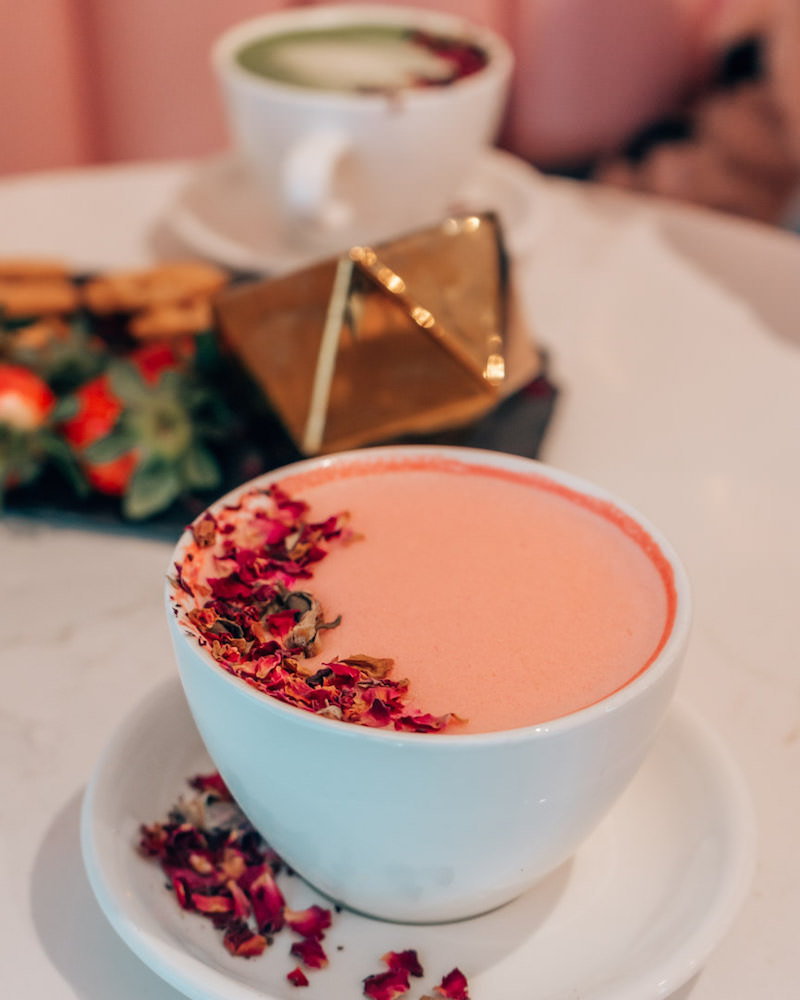 Pink latte with rose petals