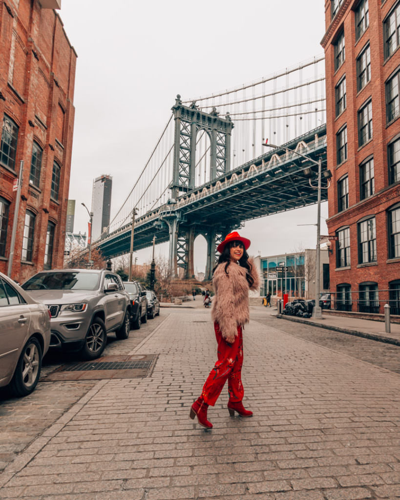 Woman standing in front of Manhattan Bridge