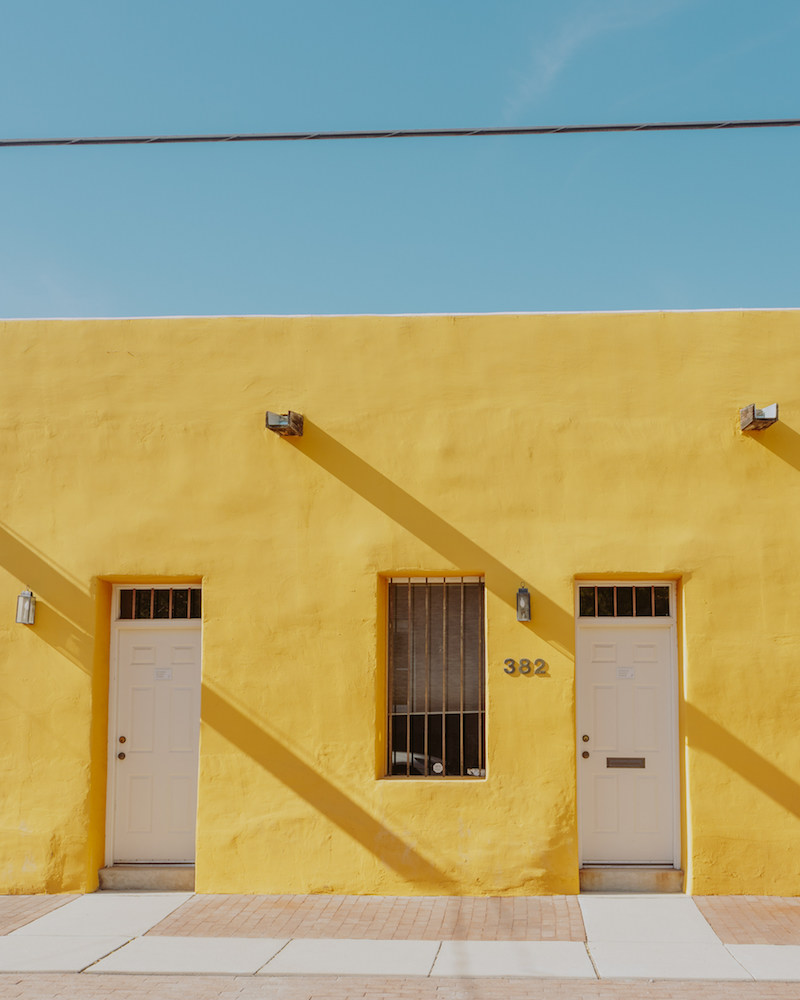 Bright yellow adobe style home