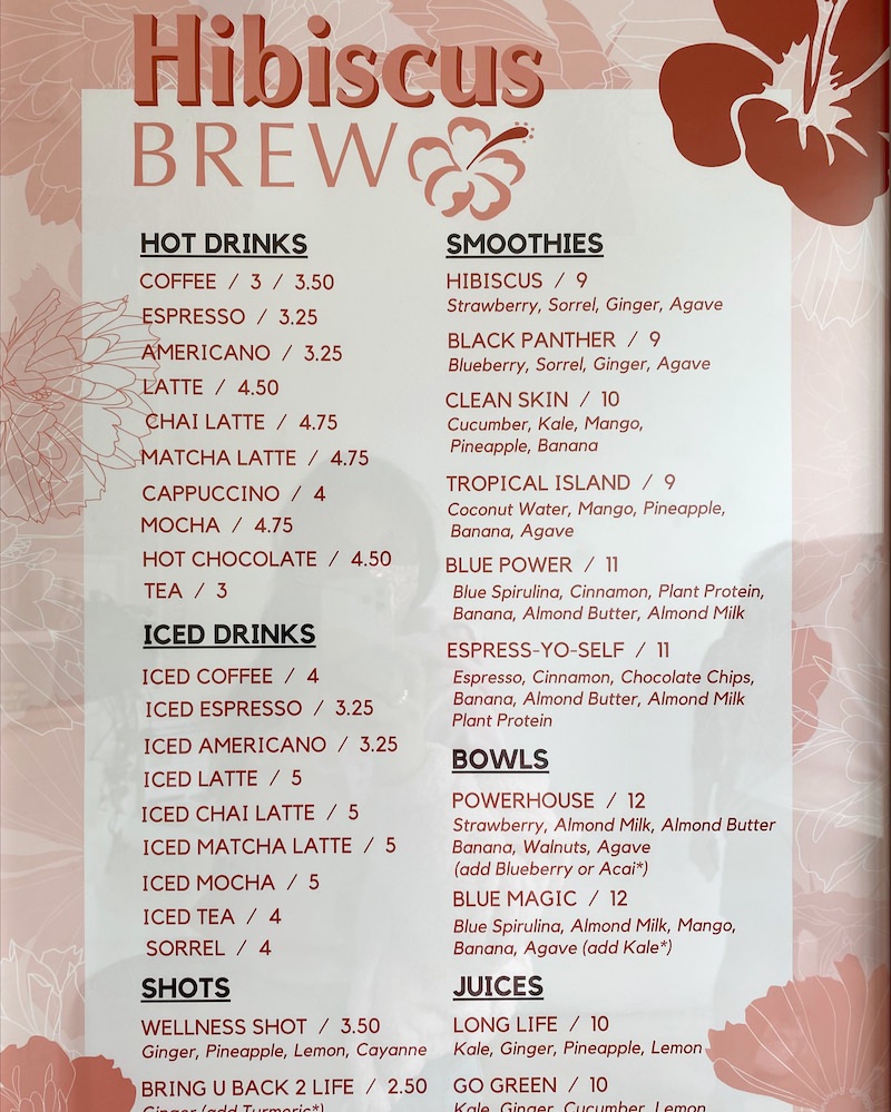 A pink and white coffee shop menu.