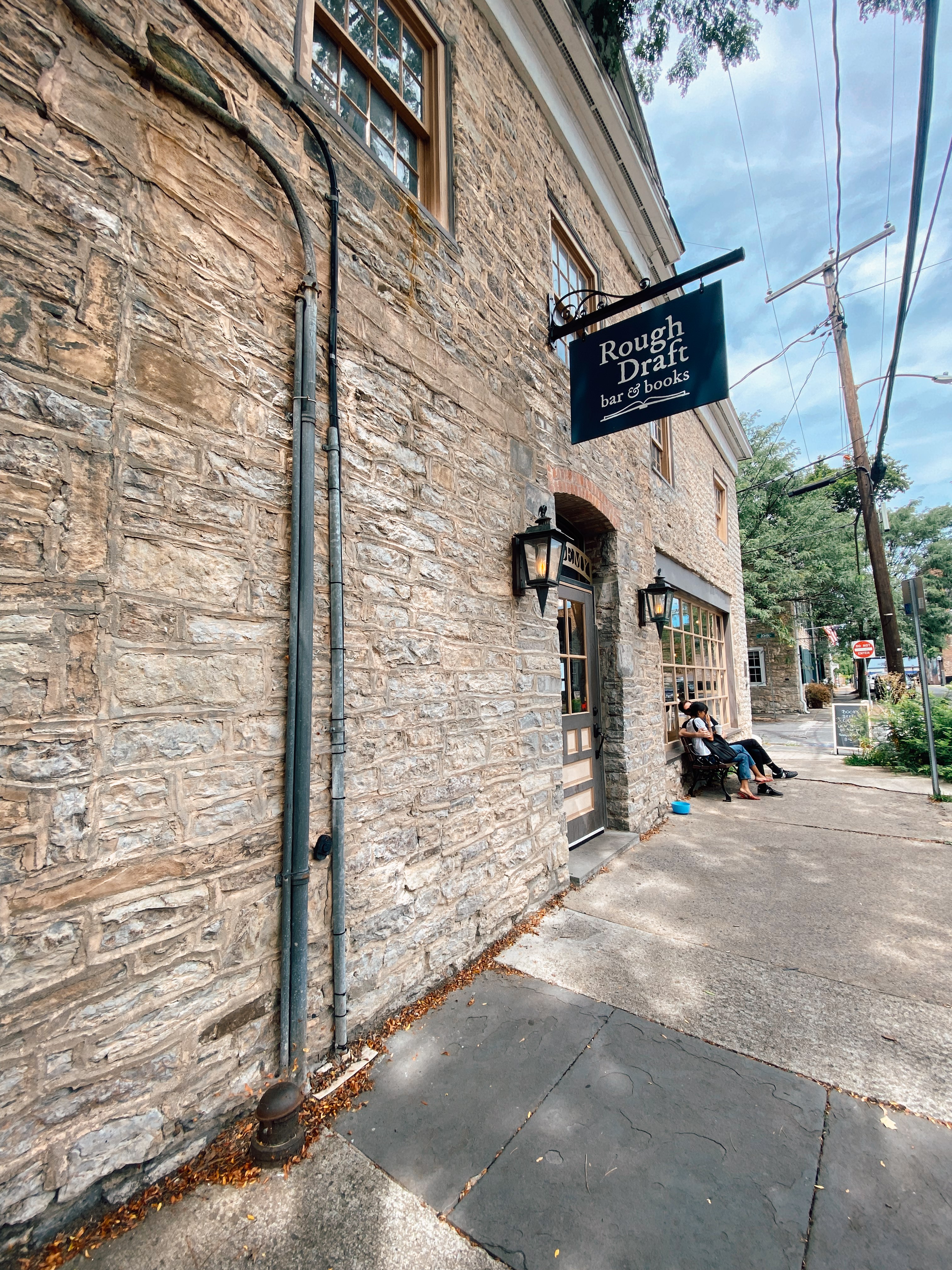 The beige stone exterior of Rough Draft books, one of the best things to do in Kingston, NY