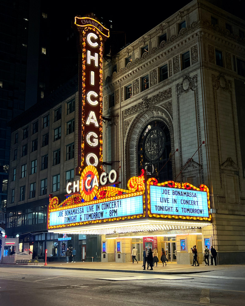 An orange and red theater marquee that reads "Theater Chicago"