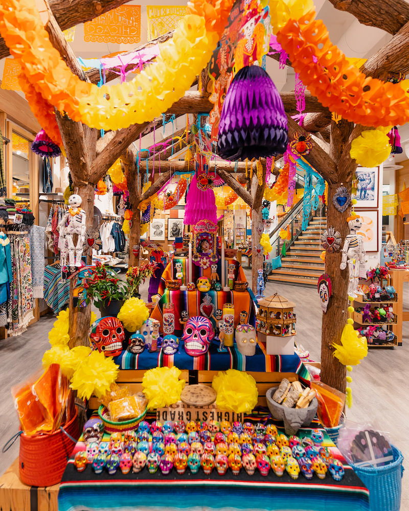 The interior of a Mexican art store in Chicago filled with colorful figurines, decorations and other goods.